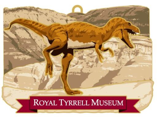 Ornament featuring a brown dinosaur showing its teeth in front of a dry beige landscape. A red banner below reads “ROYAL TYRRELL MUSEUM” in white.