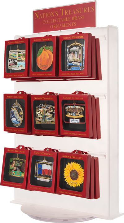White display full of hanging red boxes with windows showing colourful brass ornaments. A red sign at the top reads “NATION’S TREASURES COLLECTABLE BRASS ORNAMENTS” in yellow.