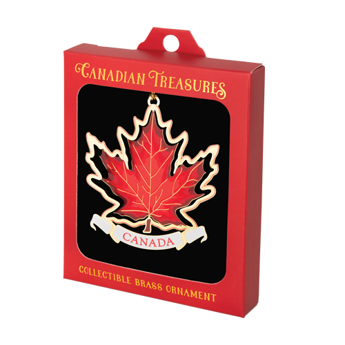 Red maple leaf ornament with white cut-out border and white banner at bottom that reads “CANADA” in red. Ornament is inside a red “Canadian Treasures” box with window.
